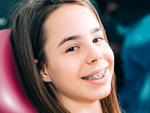 young girl in dental chair with braces