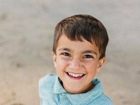 Young girl smiling after receiving dental sealants