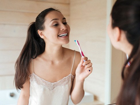 Woman brushing her teeth