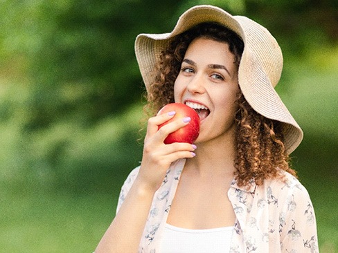 Woman eating an apple