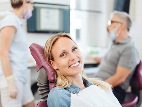 Woman smiling in the dental chair