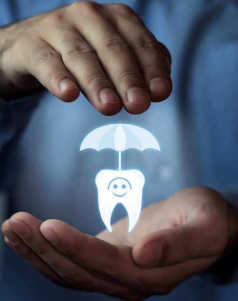 Hand holding animated tooth under an umbrella