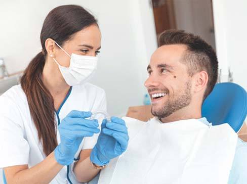dentist in Garland answering Invisalign questions
