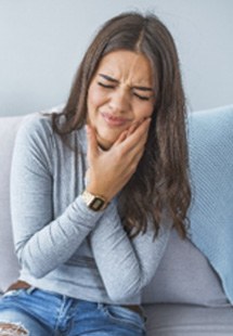 Closeup of woman with toothache at home