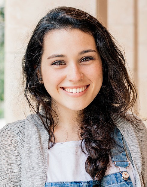 Young woman with healthy smile after orthodontic treatment