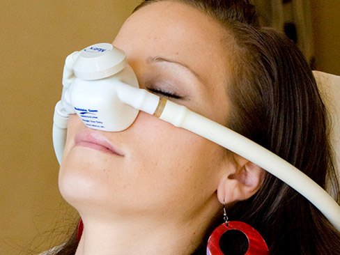Patient with nitrous oxide dental sedation nasal mask