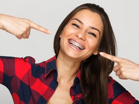 A patient with traditional braces in Garland, TX