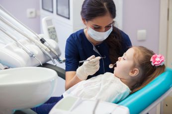 Little girl getting a dental exam