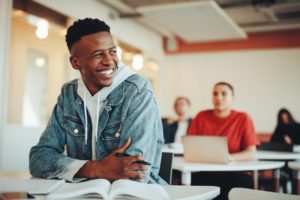 smiling teenager in a classroom 