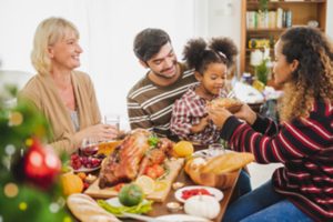 a family enjoying their Thanksgiving meal in Garland