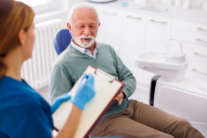 a patient during their dental implant consultation