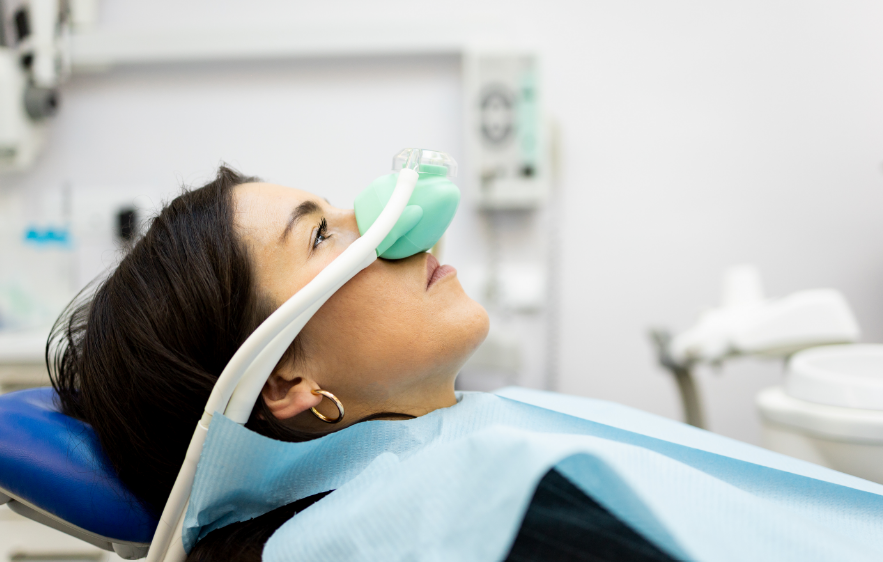 Woman with nitrous oxide mask